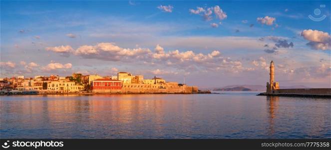 Panorama of picturesque old port of Chania is one of landmarks and tourist destinations of Crete island in the morning on sunrise. Chania, Crete, Greece. Picturesque old port of Chania, Crete island. Greece