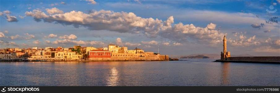 Panorama of picturesque old port of Chania is one of landmarks and tourist destinations of Crete island in the morning on sunrise. Chania, Crete, Greece. Picturesque old port of Chania, Crete island. Greece