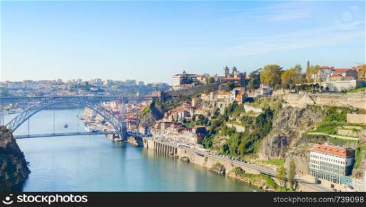 Panorama of Porto Old Town on Douro river banks with famous Dom Luis I Bridge, Portugal