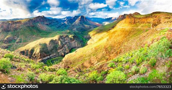Panorama of rocky volcanic landscape with mountains and canyons in natural park of Gran Canaria island, Spain