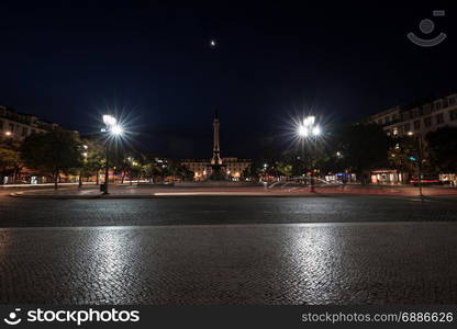 Panorama of Rossio Square in Lisbon at night, Portugal.