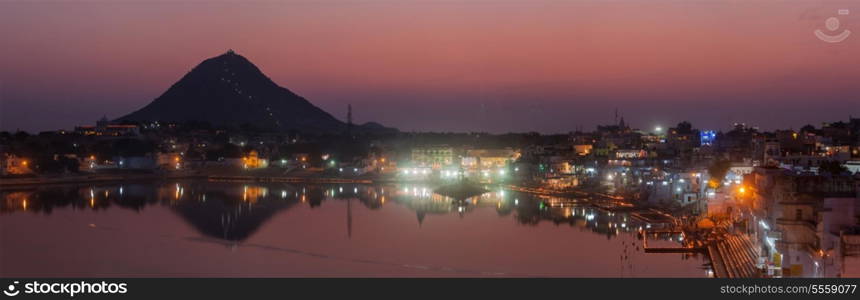 Panorama of Sacred Puskhar lake (Sagar) and ghats of town Pushkar in twilight in the evening, Rajasthan, India