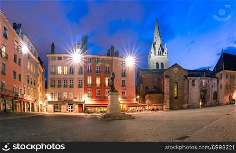 Panorama of Saint Andrew square with Collegiate Church of Saint Andrew at night, Grenoble, France. Saint Andrew square in Grenoble, France