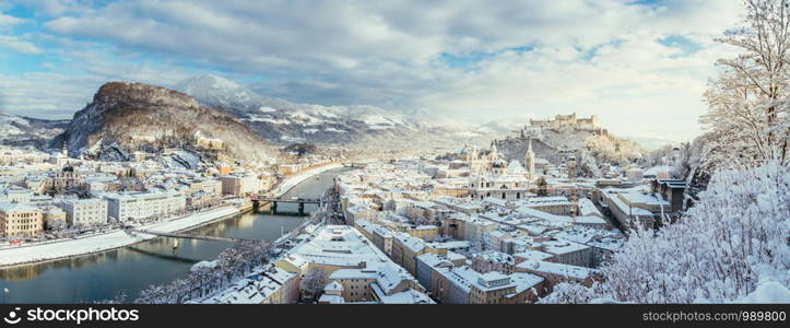 Panorama of Salzburg in winter: Snowy historical center, sunshine