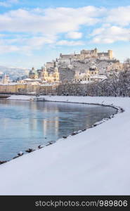 Panorama of Salzburg in winter: Snowy historical center, sunshine