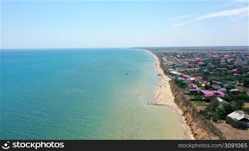 Panorama of sea shore in South Ukraine, Europe. Resort city with nice sand beach and clear blue sea. travel destination, ideal place for comfort vacation on black Sea. Drone photo.. Panorama of sea shore in South Ukraine, Europe. Resort city with nice sand beach and clear blue sea. travel destination, ideal place for comfort vacation on black Sea. Drone photo