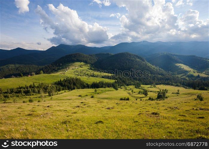Panorama of summer sunny mountains rural landscape