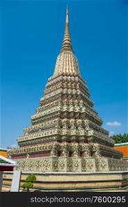 Panorama of Temple of Reclining Buddha or Wat Pho complex, view to Phra Maha Chedi Si Rajakarn group. Bangkok, Thailand