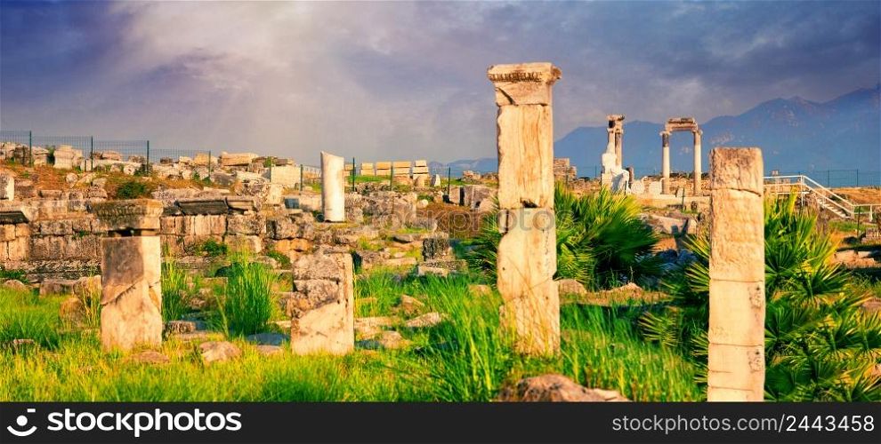 Panorama of the ancient city of Hierapolis with a statue of Pluto in Pamukkale. UNESCO cultural heritage. Denizli, Turkey. Panorama of ancient city of Hierapolis with statue of Pluto in Pamukkale