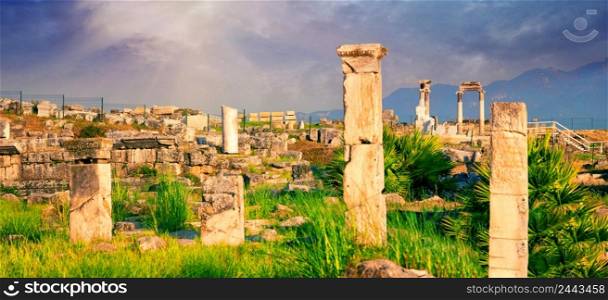Panorama of the ancient city of Hierapolis with a statue of Pluto in Pamukkale. UNESCO cultural heritage. Denizli, Turkey. Panorama of ancient city of Hierapolis with statue of Pluto in Pamukkale