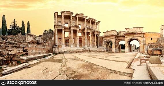 Panorama of the antique library of Celsus in Ephesus under the yellow sky. Turkey. UNESCO cultural heritage. Panorama of antique library of Celsus in Ephesus under yellow sky
