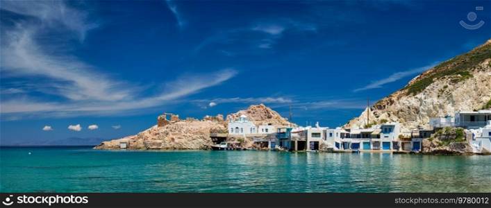 Panorama of the beach and fishing village of Firapotamos in Milos island, Greece. The beach of Firapotamos in Milos, Greece