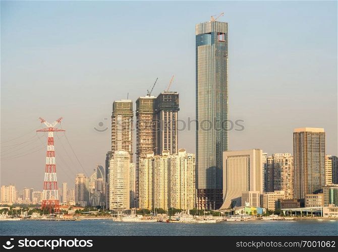 Panorama of the city skyline of Xiamen in China from the ocean. Skyline of the city of Xiamen from the sea approaching port