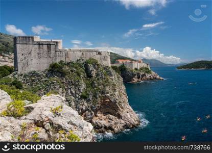 Panorama of the cliffside under Fort Lawrence and city walls of the old town in Dubrovnik. Fort Lawrence and city walls of the old town of Dubrovnik in Croatia