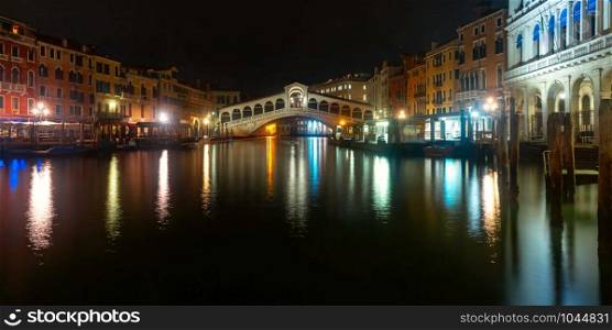Panorama of the Grand Canal and famous Rialto Bridge or Ponte di Rialto in Venice at dark night, Italy.. The Rialto Bridge, Venice, Italy
