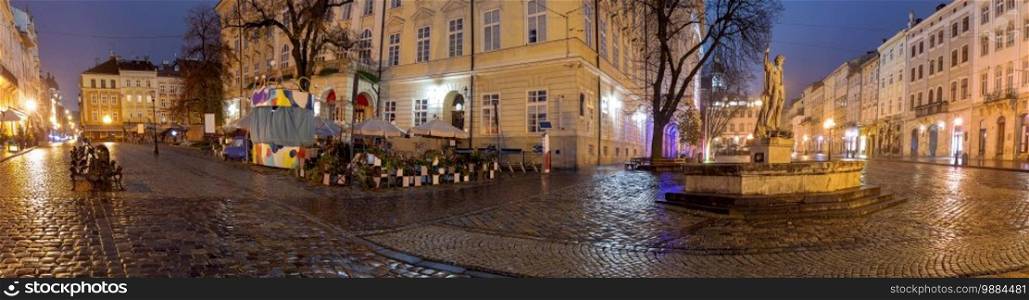 Panorama of the medieval town hall square of the Old Town at night. Lviv. Ukraine.. Lviv. Town Hall Square at Dawn.