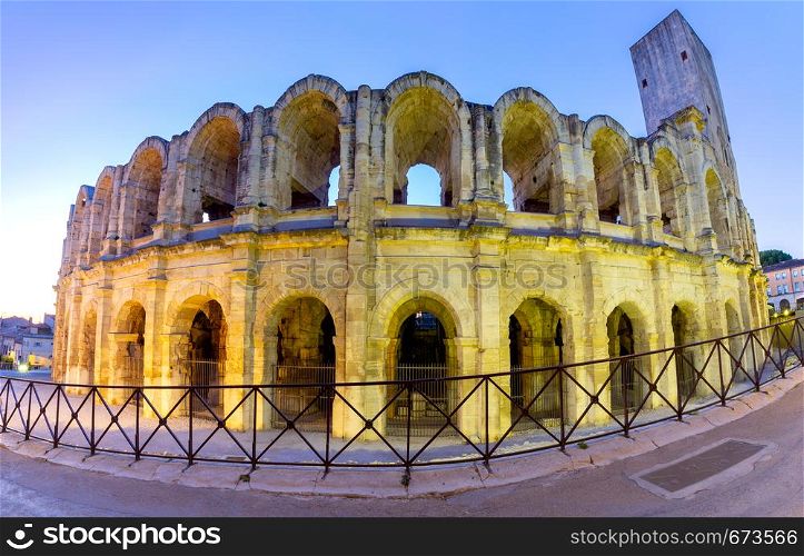 Panorama of the old antique roman arena of the amphitheater at sunrise. Arles. France. Provence. France. Arles. Old antique roman amphitheater arena.