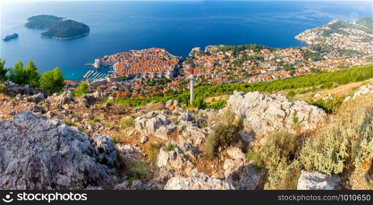 Panorama of the old medieval historical part of the city on a sunny morning. Dubrovnik. Croatia.. Panoramic aerial view of Dubrovnik on a sunny morning.