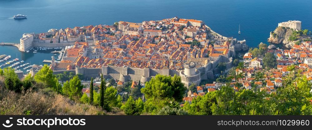 Panorama of the old medieval historical part of the city on a sunny morning. Dubrovnik. Croatia.. Panoramic aerial view of Dubrovnik on a sunny morning.