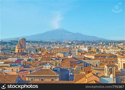 Panorama of the old town of Catania and Etna volcano in the background, Sicily Island, Italy