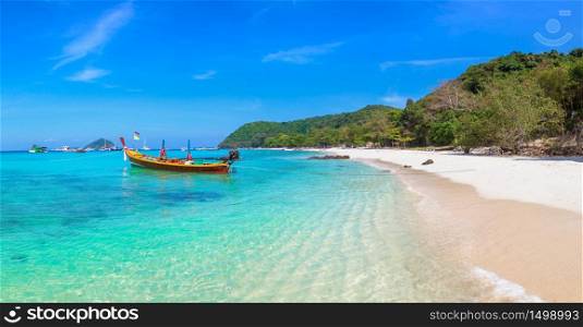 Panorama of Traditional long tail boat on Coral (Ko He) island near Phuket island, Thailand in a summer day