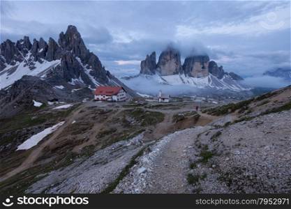 Panorama of Tre Cime and Monte Paterno at cloudy morning, Italian Dolomites