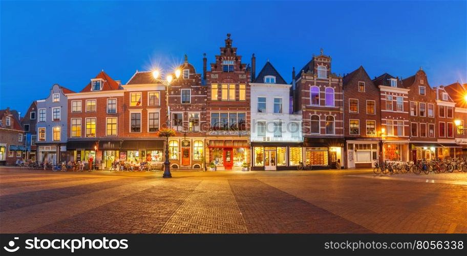 Panorama of typical Dutch houses on the Markt square in the center of the old city at night, Delft, Holland, Netherlands