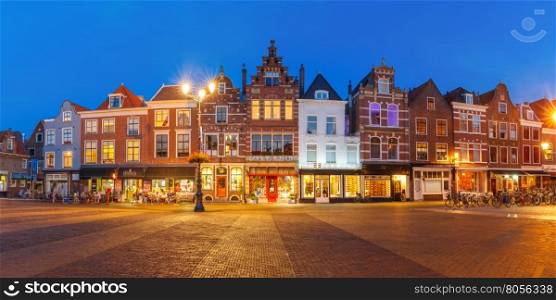 Panorama of typical Dutch houses on the Markt square in the center of the old city at night, Delft, Holland, Netherlands