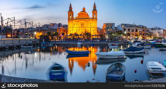 Panorama of Valletta harbour with yachts and fishing boats, Msida Parish Church of Saint Joseph at sunset, Malta. Valletta Skyline from Sliema at sunset, Malta