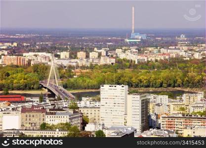 Panorama of Warsaw in Poland, on the first plan Srodmiescie district, farther Swietokrzyski bridge over Vistula river and Prague district