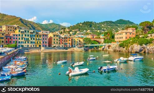 Panorama of waterfront and small harbour iwith boats n Genoa Nervi town in the evening, Genova, Italy