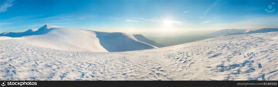 Panorama of winter mountains and hills in snow