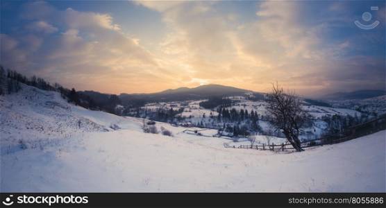 Panorama of winter mountains sunrise