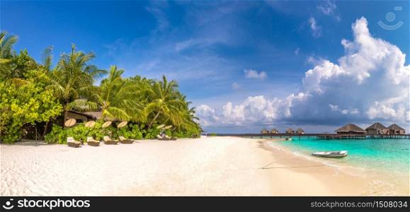 Panorama of Wooden sunbed on tropical beach in the Maldives at summer day