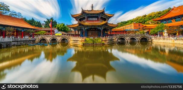 Panorama of Yuantong Temple refletion with waterfront, Kunming capital city of Yunnan, China, travel and tourism,famous place and landmark, religion and traditional concept
