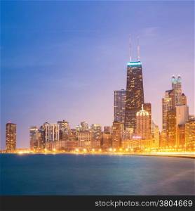 Panorama shot of Chicago downtown and Lake Michigan at dusk.