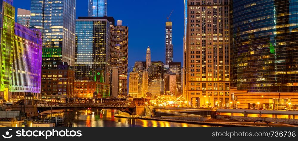 Panorama shot of City of Chicago downtown and Chicago River sunset night in Chicago Illinois USA.