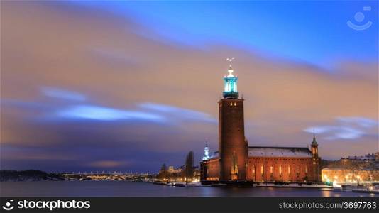 Panorama Stockholm Cityhall at dusk with transportation light trail Sweden