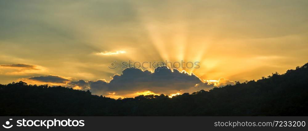 Panorama summer sunset golden cloud summertime light sunny day cloudscape mountain scene. Panoramic sunset golden skyline sun beam over cloud climate background. Heaven gold landscape panoramic banner