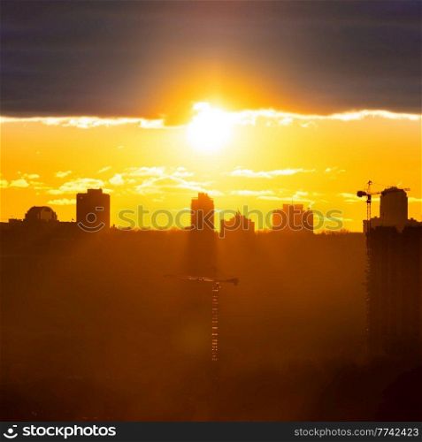 Panorama sunset in city with building silhouette, Kiev city