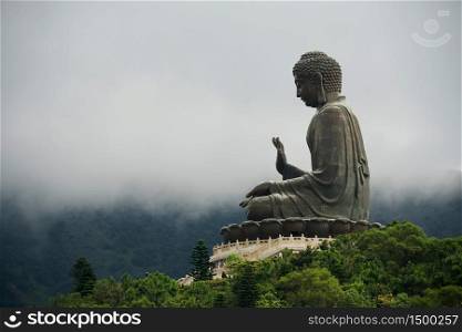 Panorama view of a giant bronze buddha statue. Taken in Lantau Island, Hong Kong, China.