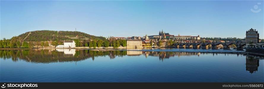 Panorama view of Charles bridge over Vltava river and Gradchany (Prague Castle) and St. Vitus Cathedral in the morning, Prague, Czech Republic