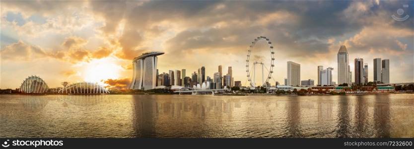 Panorama view of Singapore financial district skyline at Marina bay when sunset, Singapore city, South east asia.. Panorama view of Singapore financial district skyline at Marina bay when sunset.
