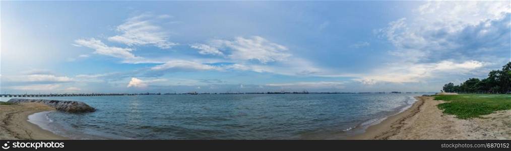 Panorama View of the sea and Bedok Jetty from East Coast Park in Singapore under the beautiful blue sky with cloudy