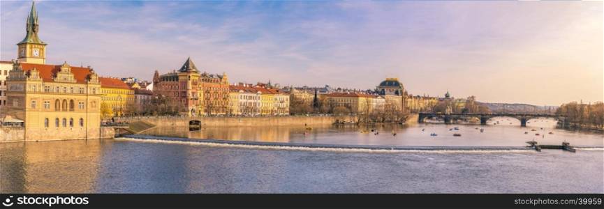 Panorama view with the buildings of Prague, the capital of Czech Republic and the Vltava river, on a sunny day of spring.