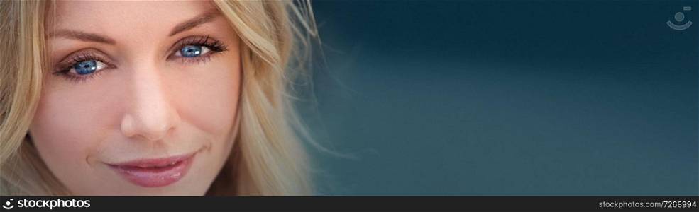Panorama web banner portrait of naturally beautiful woman in her twenties with blond hair and blue eyes