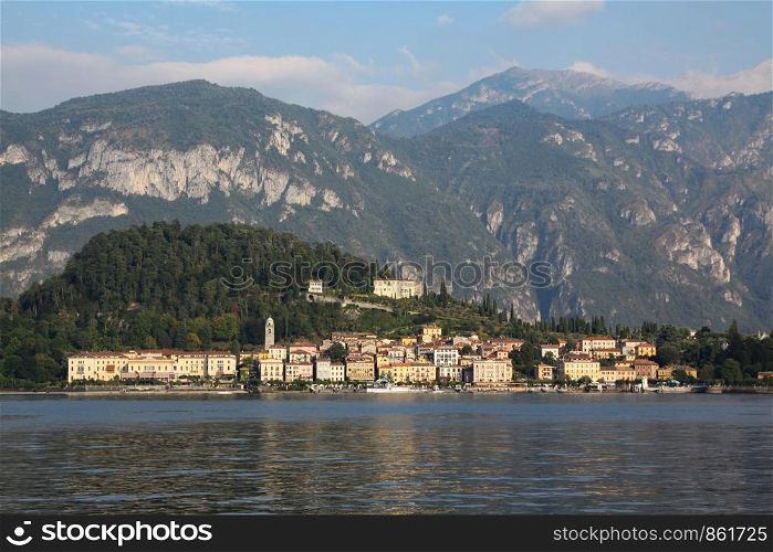 Panorama with mountain lake and picturesque village in Italy
