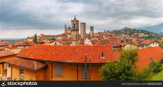 Panoramic aerial view of Medieval Upper town Citta alta of Bergamo with towers and churchesin nasty cloydy day, Lombardy, Italy