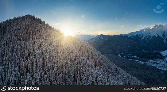 Panoramic aerial view of the sun setting over the mountains