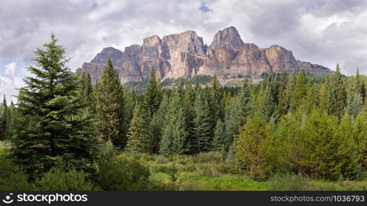 Panoramic image of Castle Mountain under cloudy sky, Bow Valley Parkway, Banff National Park, Alberta, Canada